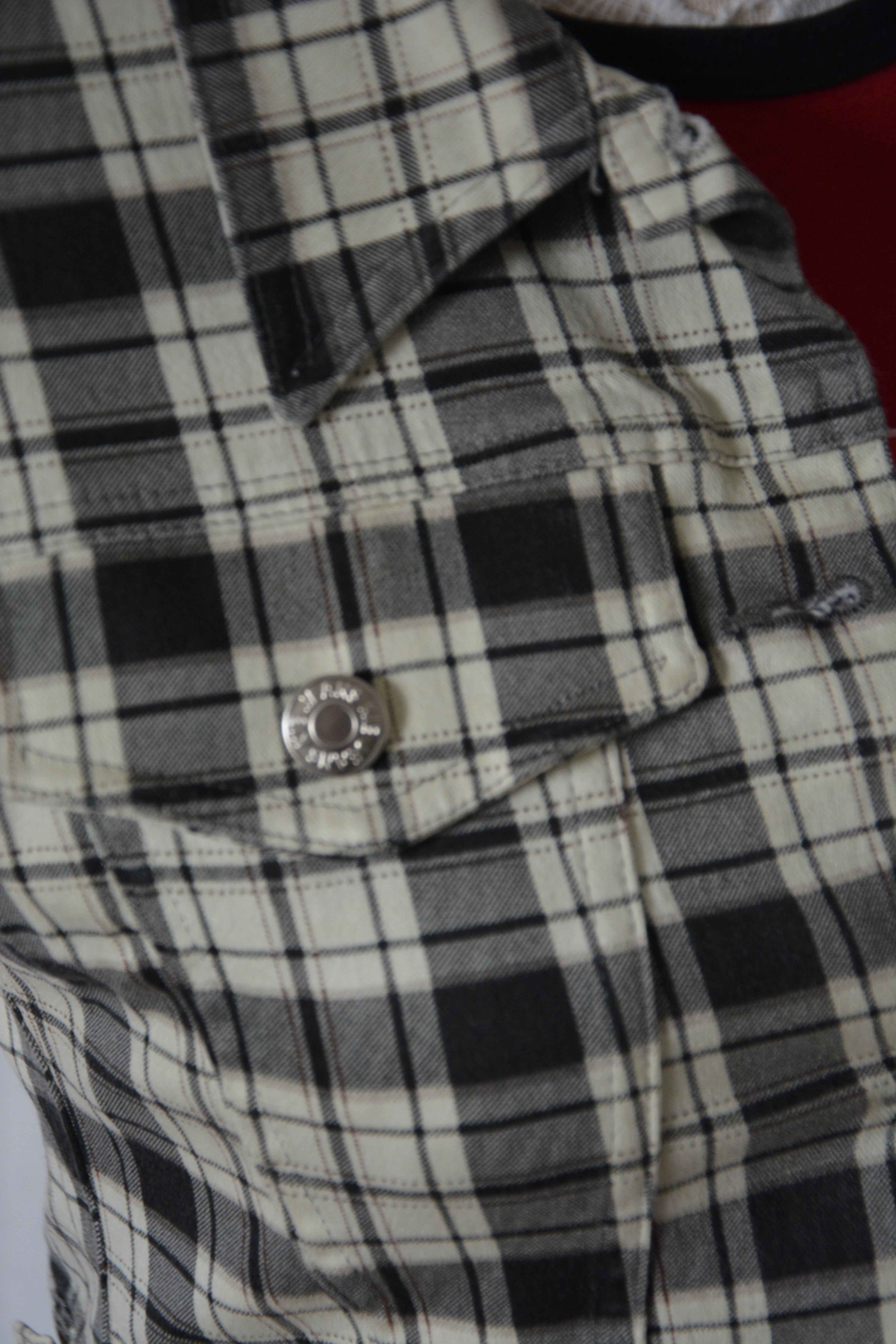 Veste courte sans manches à carreaux